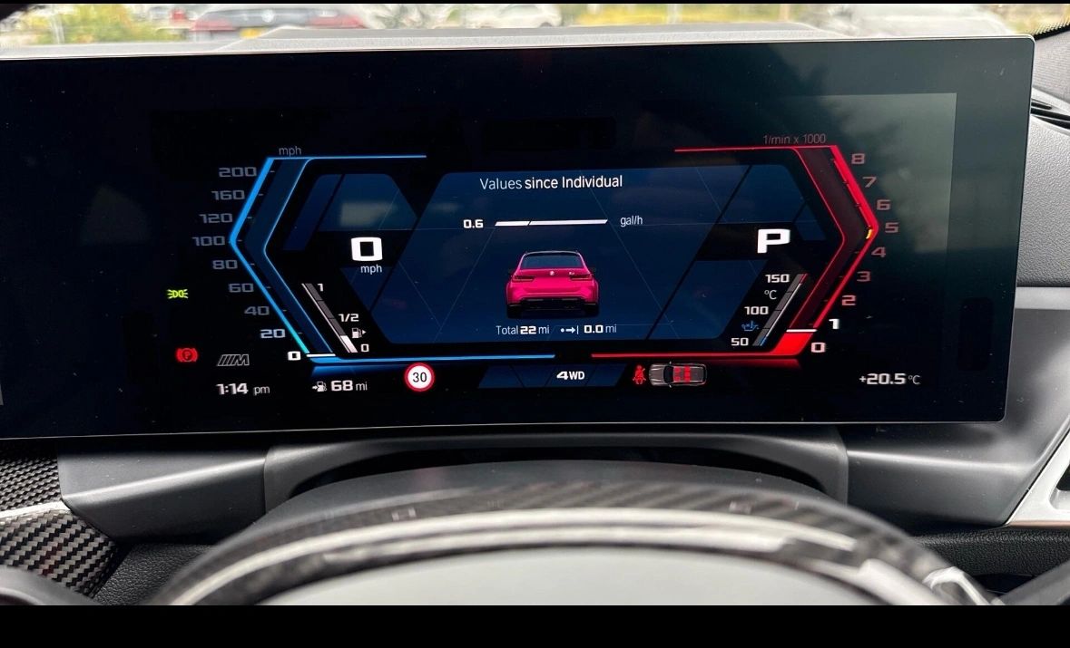 BMW digital dashboard display showing real-time performance metrics